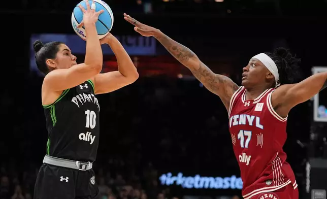 Phantom BC guard Kelsey Plum (10) shoots over Vinyl BC guard Erica Wheeler (17) during the second half of a semifinal in their Unrivaled 3-on-3 basketball game, Monday, March 2, 2026, in New York. (AP Photo/Frank Franklin II)