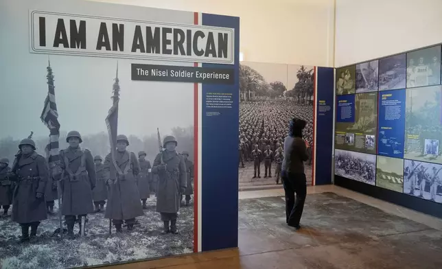 Rosalyn Tonai, Executive Director at the National Japanese American Historical Society, walks through the "I am an American: The Nisei Soldier Experience" exhibit during an interview at the Military Intelligence Service Historic Learning Center in San Francisco, Wednesday, Feb. 25, 2026. (AP Photo/Jeff Chiu)