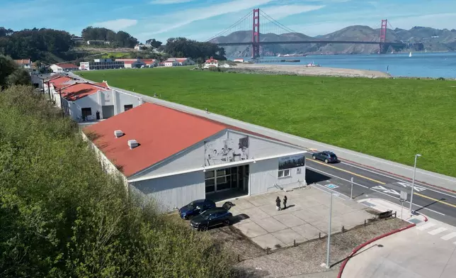 People walk outside of the Military Intelligence Service Historic Learning Center, which is displaying the "I am an American: The Nisei Soldier Experience" exhibit, in San Francisco, Thursday, Feb. 26, 2026. (AP Photo/Terry Chea)