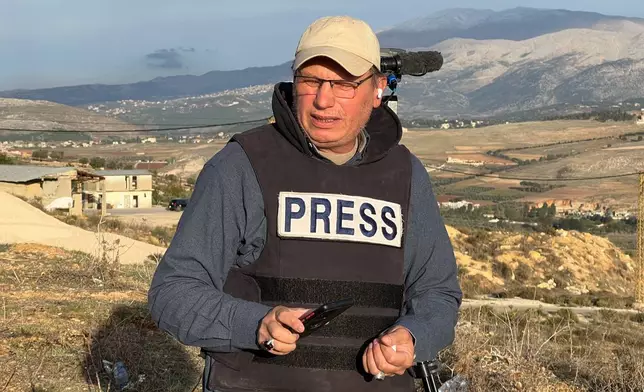 Hezbollah's al-Manar TV correspondent Ali Shoeib, who was killed in an Israeli strike in Jezzine along with other journalists on Saturday, March 28, 2026, is seen reporting in the town of Marjayoun, Wednesday, Nov. 22, 2024. (AP Photo/Hussein Malla)