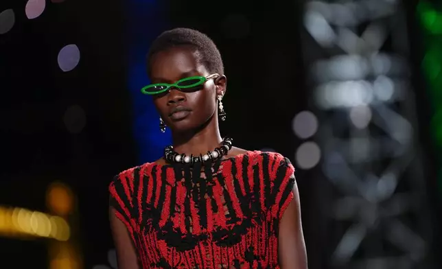 A model wears a creation as part of the Chanel Fall/Winter 2026-2027 Women's collection presented in Paris, Monday, March 9, 2026. (AP Photo/Aurelien Morissard)