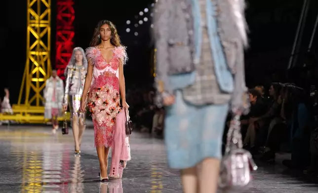 A model wears a creation as part of the Chanel Fall/Winter 2026-2027 Women's collection presented in Paris, Monday, March 9, 2026. (AP Photo/Aurelien Morissard)