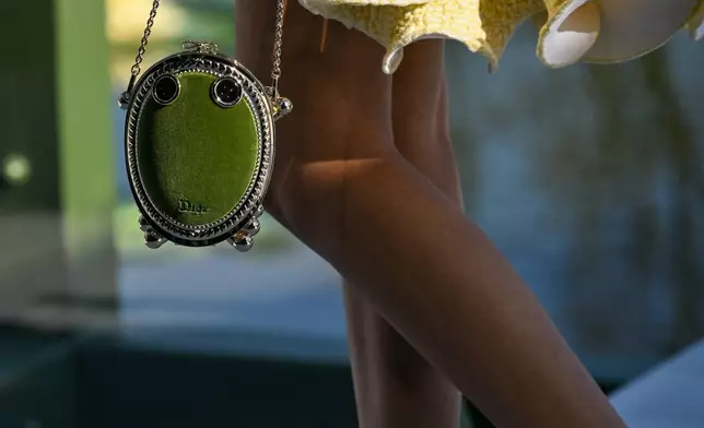 A model wears a creation from the Christian Dior Fall/Winter 2026-2027 Women's collection presented in Paris, Tuesday, March 3, 2026. (AP Photo/Emma Da Silva)