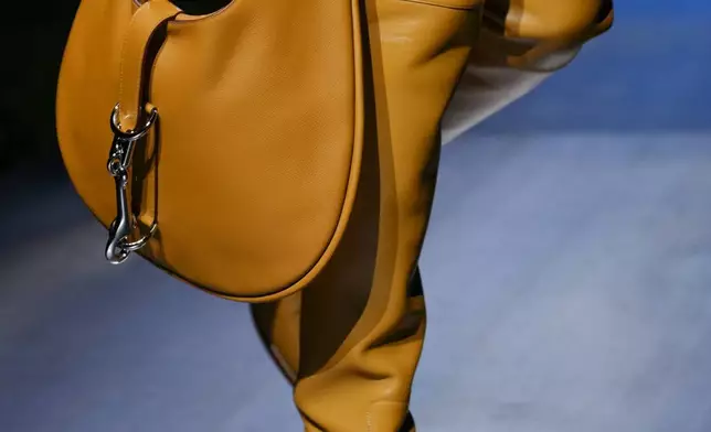 A model wears a creation as part of the Hermes Fall/Winter 2026-2027 Women's collection presented in Paris, Saturday, March 7, 2026. (AP Photo/Aurelien Morissard)