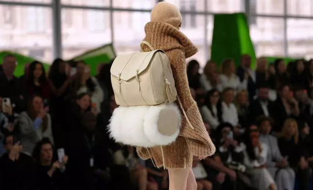 A model wears a creation from the Louis Vuitton Fall/Winter 2026-2027 Women's collection presented in Paris, Tuesday, March 10, 2026. (AP Photo/Aurelien Morissard)