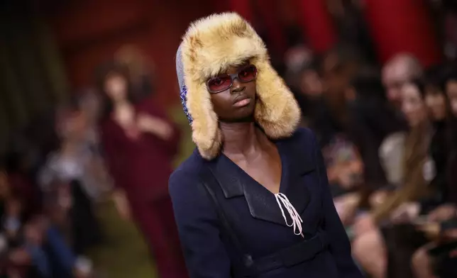 A model wears a creation from the Miu Miu Fall/Winter 2026-2027 Women's collection presented in Paris, Tuesday, March 10, 2026. (AP Photo/Tom Nicholson)