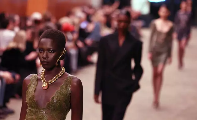 A model wears a creation from the Saint Laurent Fall/Winter 2026-2027 Women's collection presented in Paris, Tuesday, March 3, 2026. (AP Photo/Tom Nicholson)