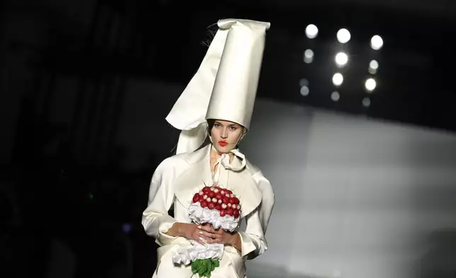 A model wears a creation from the Vivienne Westwood Fall/Winter 2026-2027 Women's collection presented in Paris, Saturday, March 7, 2026. (AP Photo/Tom Nicholson)