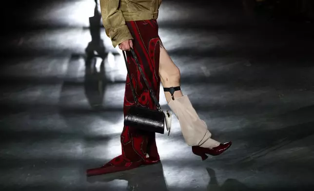 A model wears a creation from the Vivienne Westwood Fall/Winter 2026-2027 Women's collection presented in Paris, Saturday, March 7, 2026. (AP Photo/Tom Nicholson)