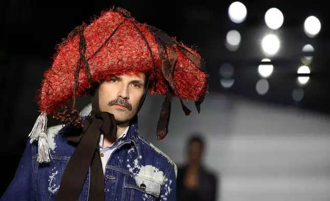 A model wears a creation from the Vivienne Westwood Fall/Winter 2026-2027 Women's collection presented in Paris, Saturday, March 7, 2026. (AP Photo/Tom Nicholson)