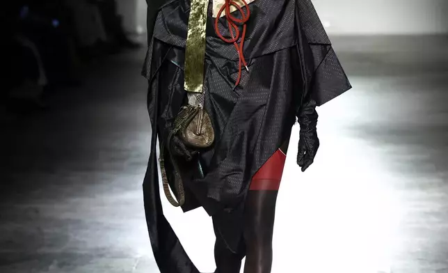 A model wears a creation from the Vivienne Westwood Fall/Winter 2026-2027 Women's collection presented in Paris, Saturday, March 7, 2026. (AP Photo/Tom Nicholson)