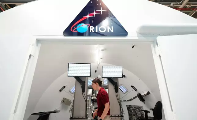 Jacki Mahaffey, chief training officer for Artemis II, prepares for a training mission in the Orion Mission Simulator at Johnson Space Center on Friday, July 25, 2025, in Houston. (AP Photo/Ashley Landis)