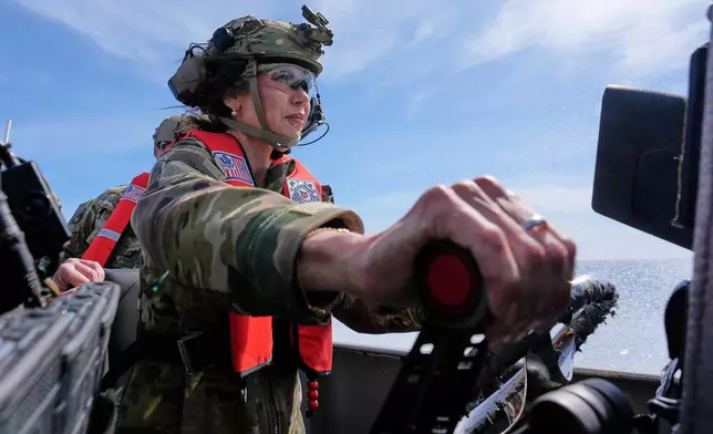 FILE - Homeland Security Secretary Kristi Noem pilots a U.S. Coast Guard Response Boat Small with the Maritime Security Response Team, March 16, 2025, in San Diego. (AP Photo/Alex Brandon, File)