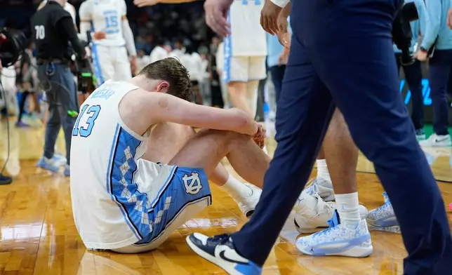 North Carolina center Henri Veesaar (13) dejects after a loss in over time to Virginia Commonwealth during the first round of the NCAA college basketball tournament, Thursday, March 19, 2026, in Greenville, S.C. (AP Photo/Brynn Anderson)