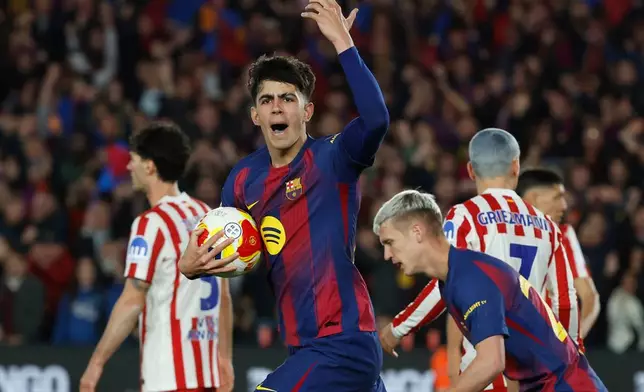 Barcelona's Marc Bernal celebrates after scoring his side's third goal during the Copa del Rey semifinal second leg soccer match between Barcelona and Atletico Madrid in Barcelona, Spain, Tuesday, March 3, 2026. (AP Photo/Joan Monfort)
