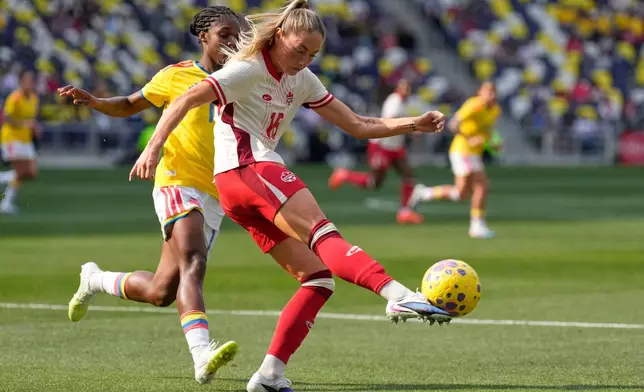 Canada forward Janine Sonis (16) kicks the ball past Colombia midfielder Linda Caicedo, left, during the second half of a SheBelieves Cup women's soccer tournament match Sunday, March 1, 2026, in Nashville, Tenn. (AP Photo/George Walker IV)