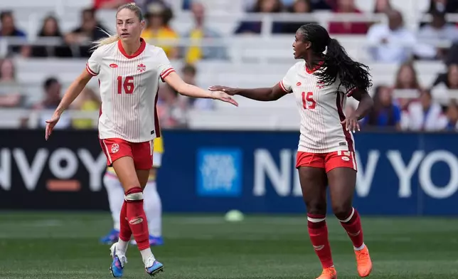 Canada forward Janine Sonis (16) celebrates her goal with teammate Nichelle Prince (15) during the second half of a SheBelieves Cup women's soccer tournament match Sunday, March 1, 2026, in Nashville, Tenn. (AP Photo/George Walker IV)