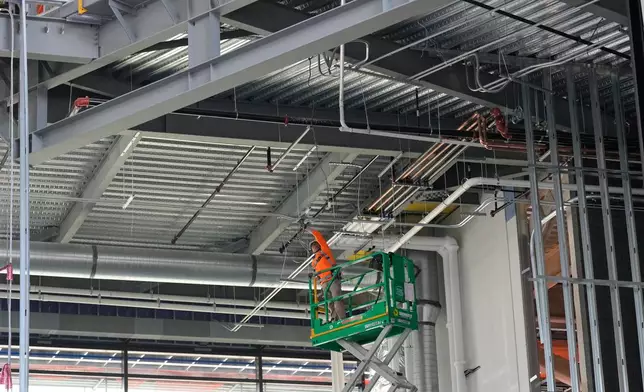 Construction continues on a new enclosed stadium for the Tennessee Titans NFL football team, Tuesday, March 24, 2026, in Nashville, Tenn. (AP Photo/George Walker IV)