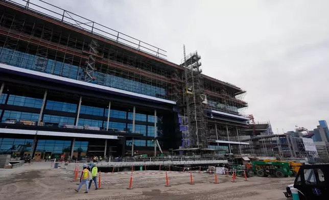 Construction continues on a new enclosed stadium for the Tennessee Titans NFL football team, Tuesday, March 24, 2026, in Nashville, Tenn. (AP Photo/George Walker IV)