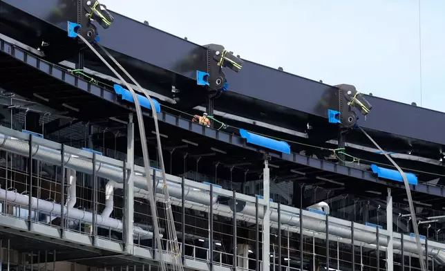 Construction continues on a new enclosed stadium for the Tennessee Titans NFL football team, Tuesday, March 24, 2026, in Nashville, Tenn. (AP Photo/George Walker IV)