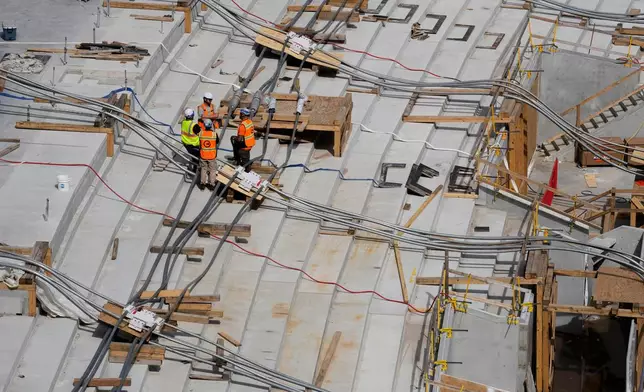 Construction continues on a new enclosed stadium for the Tennessee Titans NFL football team, Tuesday, March 24, 2026, in Nashville, Tenn. (AP Photo/George Walker IV)