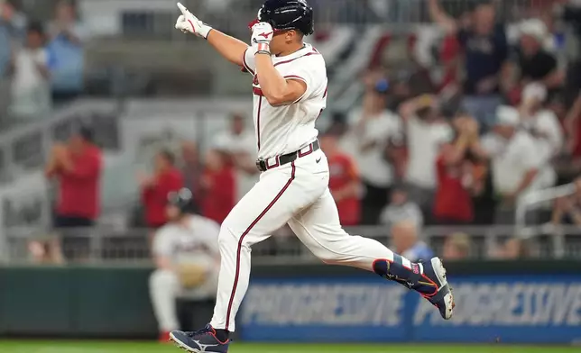 Atlanta Braves' Drake Baldwin (30) celebrates his solo home run against the Kansas City Royals during the third inning of an opening-day baseball game, Friday, March 27, 2026, in Atlanta. (AP Photo/Mike Stewart)