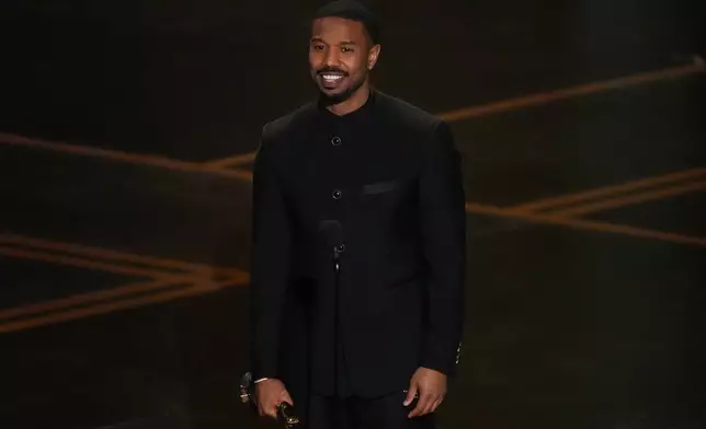 Michael B. Jordan accepts the award for actor in a leading role for "Sinners" during the Oscars on Sunday, March 15, 2026, at the Dolby Theatre in Los Angeles. (AP Photo/Chris Pizzello)