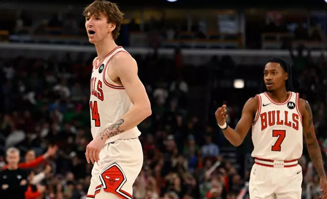 Chicago Bulls' Matas Buzelis (14) yells to the Memphis Grizzlies bench after making a basket during the second half of an NBA basketball game in Chicago, Monday, March 16, 2026. (AP Photo/Paul Beaty)