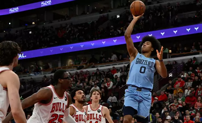 Memphis Grizzlies' Jaylen Wells (0) goes up to shoot during the first half of an NBA basketball game against the Chicago Bulls in Chicago, Monday, March 16, 2026. (AP Photo/Paul Beaty)