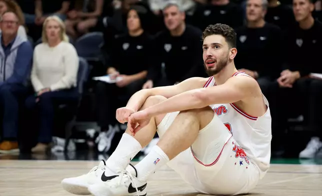 Houston Rockets center Alperen Sengun reacts during the first half of an NBA basketball game against the Minnesota Timberwolves, Wednesday, March 25, 2026, in Minneapolis. (AP Photo/Ellen Schmidt)
