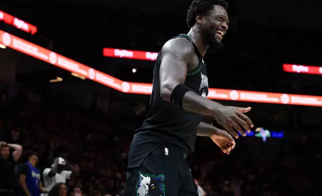 Minnesota Timberwolves forward Julius Randle reacts during the second half of an NBA basketball game against the Houston Rockets, Wednesday, March 25, 2026, in Minneapolis. (AP Photo/Ellen Schmidt)