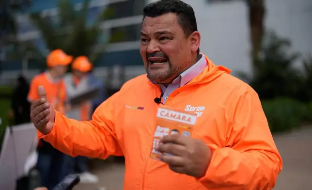 Congressman Carlos Carreño Marín, who goes by Sergio Marin, of the Comunes party, gives an interview while campaigning for reelection ahead of legislative elections in Bogota, Colombia, Thursday, Feb. 26, 2026. (AP Photo/Fernando Vergara)