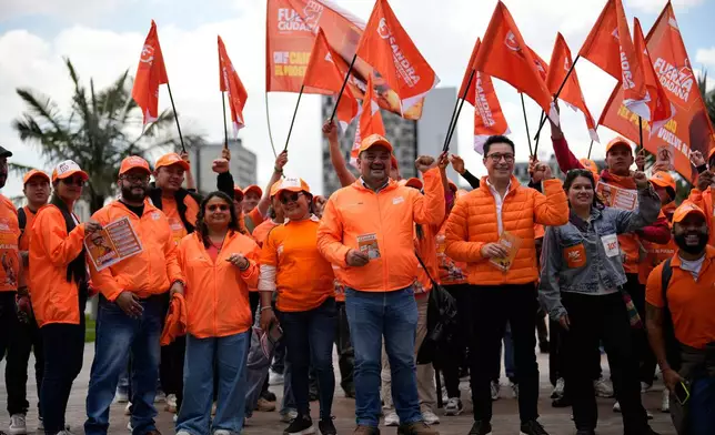 Congressman Carlos Carreño Marín, who goes by Sergio Marin, of the Comunes party, campaigns for reelection ahead of legislative elections in Bogota, Colombia, Thursday, Feb. 26, 2026. (AP Photo/Fernando Vergara)