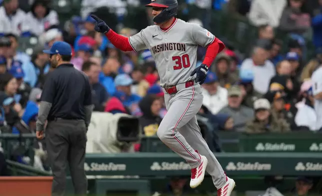 Washington Nationals' Jacob Young (30) runs the bases afer hitting a two-run home run during the fourth inning of an opening-day baseball game against the Chicago Cubs, Thursday, March 26, 2026, in Chicago. (AP Photo/Erin Hooley)