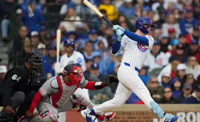 Chicago Cubs center fielder Pete Crow-Armstrong (4) hits a one-run single during the third inning of an opening-day baseball game against the Washington Nationals, Thursday, March 26, 2026, in Chicago. (AP Photo/Erin Hooley)