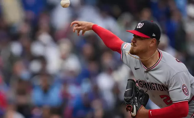 Washington Nationals starting pitcher Cade Cavalli (24) throws against the Chicago Cubs during the first inning of an opening-day baseball game Thursday, March 26, 2026, in Chicago. (AP Photo/Erin Hooley)