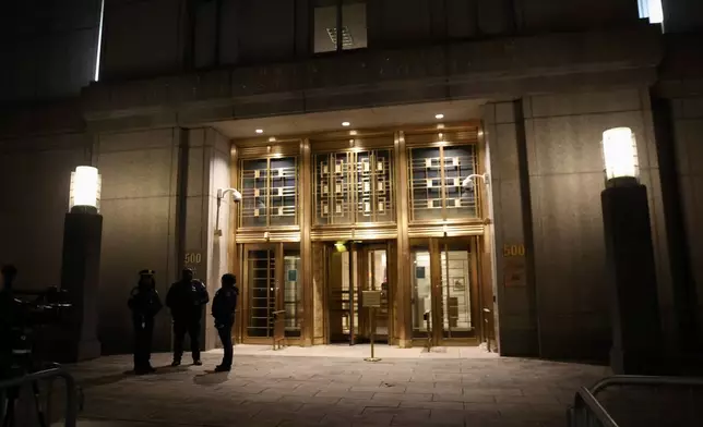 New York Police officers stand outside Manhattan federal court, Thursday, March 26, 2026, in New York. (AP Photo/Heather Khalifa)