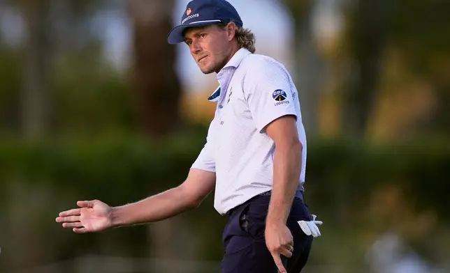 Austin Smotherman reacts to his shot on the seventh green during the first round of The Players Championship golf tournament Thursday, March 12, 2026, in Ponte Bedra Beach, Fla. (AP Photo/Gerald Herbert)