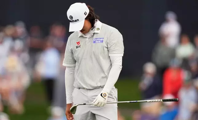 S.H. Kim of South Korea reacts to his shot on the 17th hole during the first round of The Players Championship golf tournament Thursday, March 12, 2026, in Ponte Bedra Beach, Fla. (AP Photo/Gerald Herbert)
