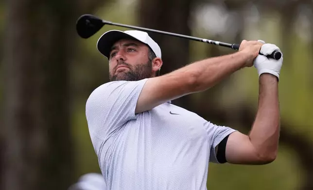 Scottie Scheffler hits his tee shot on the 12th hole during the first round of The Players Championship golf tournament Thursday, March 12, 2026, in Ponte Bedra Beach, Fla. (AP Photo/Gerald Herbert)