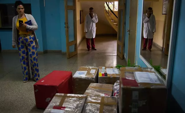 Hospital workers look at medical supplies donated by members of the European Convoy to Cuba in Havana, Monday, March 16, 2026. (AP Photo/Ramon Espinosa)