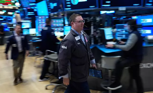 Ryan Falvey works on the floor at the New York Stock Exchange in New York, Tuesday, March 10, 2026. (AP Photo/Seth Wenig)
