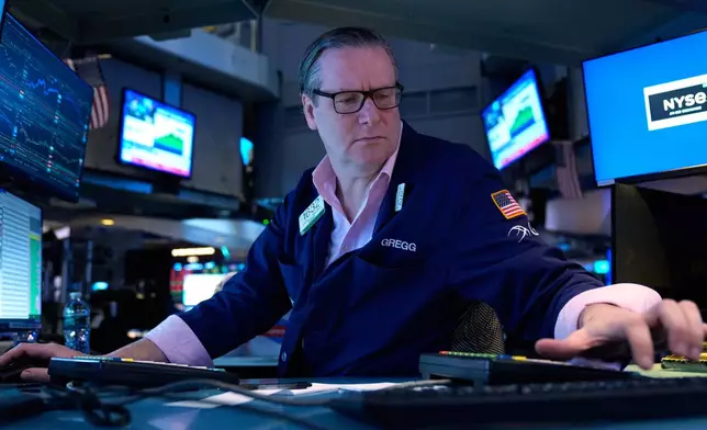 Gregg Maloney works on the floor at the New York Stock Exchange in New York, Tuesday, March 10, 2026. (AP Photo/Seth Wenig)