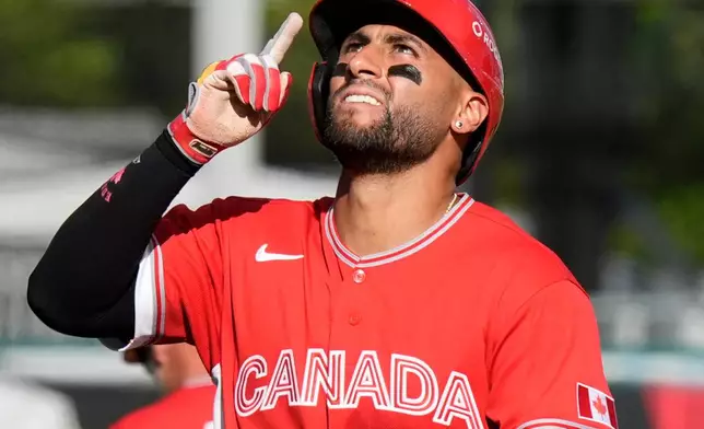 Canada's Abraham Toro celebrates while running the bases after hitting a one-run home run against Cuba during the fifth inning of a World Baseball Classic game in San Juan, Puerto Rico, Wednesday, March 11, 2026. (AP Photo/Fernando Llano)