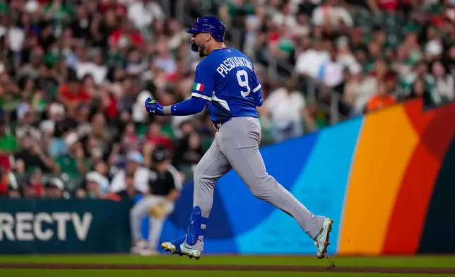 Italy first baseman Vinnie Pasquantino runs the bases after a home run in the eighth inning of a World Baseball Classic game against Mexico, Wednesday, March 11, 2026, in Houston. (AP Photo/Ashley Landis)