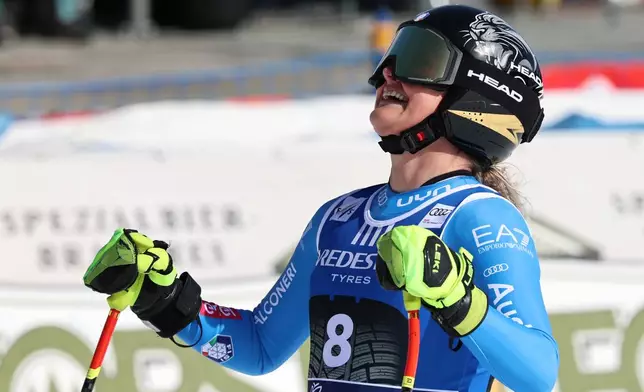 Italy's Laura Pirovano celebrates at the finish area of an alpine ski, women's World Cup downhill, in Val di Fassa, Italy, Friday, March 6, 2026. (AP Photo/Marco Trovati) CORRECTION: Date corrected to March 6, instead of February 27.