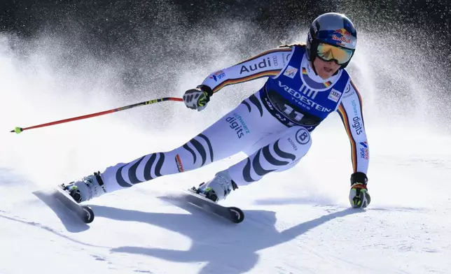 Germany's Emma Aicher speeds down the course during an alpine ski, women's World Cup downhill, in Val di Fassa, Italy, Friday, March 6, 2026. (AP Photo/Luciano Bisi) CORRECTION: Date corrected to March 6, instead of February 27.
