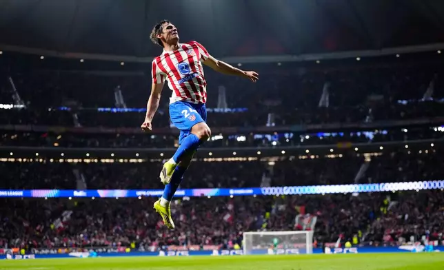 Atletico Madrid's Robin Le Normand celebrates after scoring his side's fourth goal during the first leg of the Champions League round of 16 soccer match between Atletico Madrid and Tottenham in Madrid, Spain, Tuesday, March 10, 2026. (AP Photo/Jose Breton)