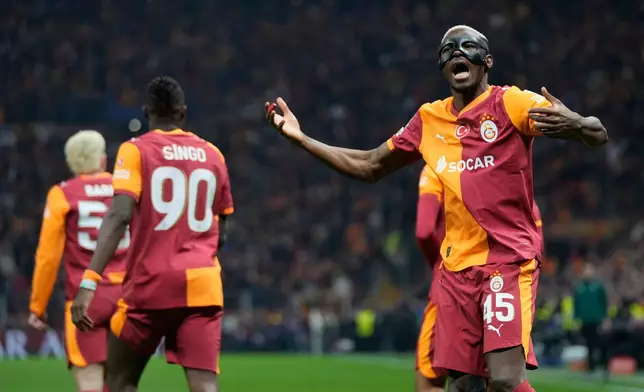 Galatasaray's Victor Osimhen celebrates after teammate Mario Lemina scored the opening goal during a Champions League round of 16 first leg soccer match between Galatasaray and Liverpool, in Istanbul, Turkey, Tuesday, March 10, 2026. (AP Photo/Khalil Hamra)