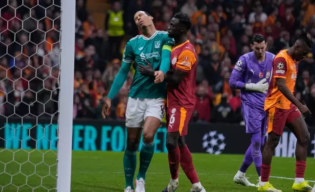 Liverpool's Virgil van Dijk, left, gestures after missing a chance during a Champions League round of 16 first leg soccer match between Galatasaray and Liverpool, in Istanbul, Turkey, Tuesday, March 10, 2026. (AP Photo/Khalil Hamra)